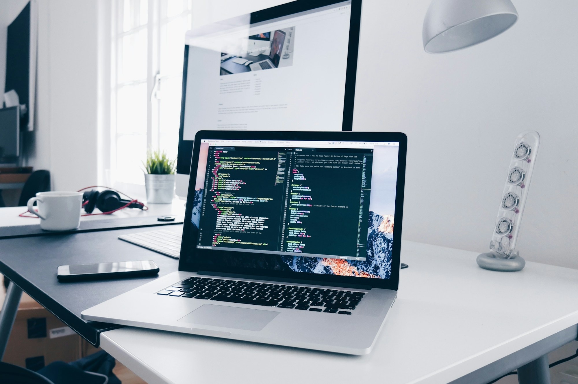 Laptop running software on a clean office desk